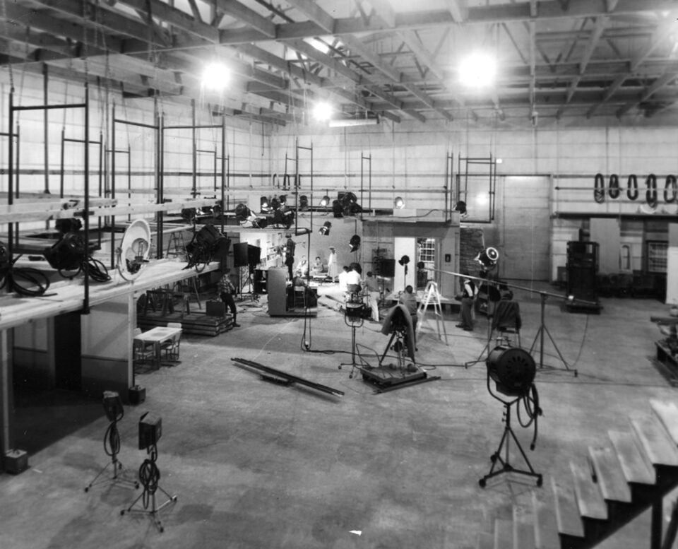 The interior of a film sound stage with lighting grid overhead